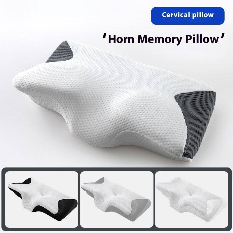 Horn-shaped cervical pillow in white on a bed, close-up of the fabric texture